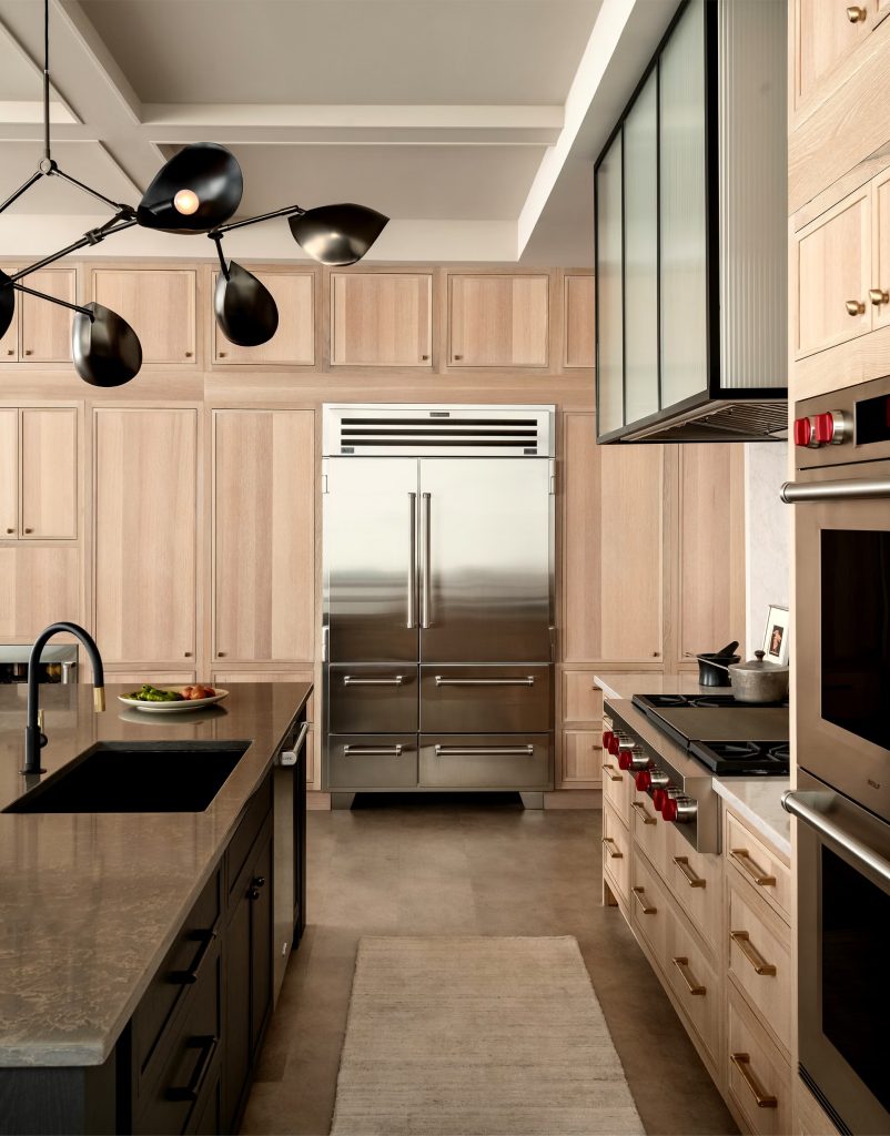 Sub-Zero built-in refrigerator repair — stainless side-by-side unit installed in a luxury Orange County kitchen.