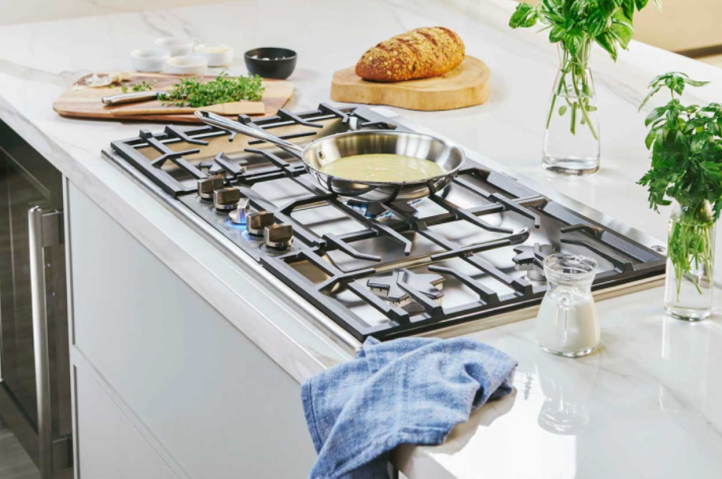 Thermador built-in gas cooktop with a pan on the burner