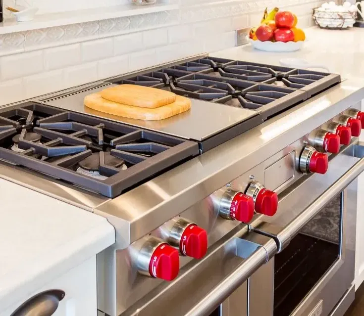 Wolf professional gas range with red control knobs