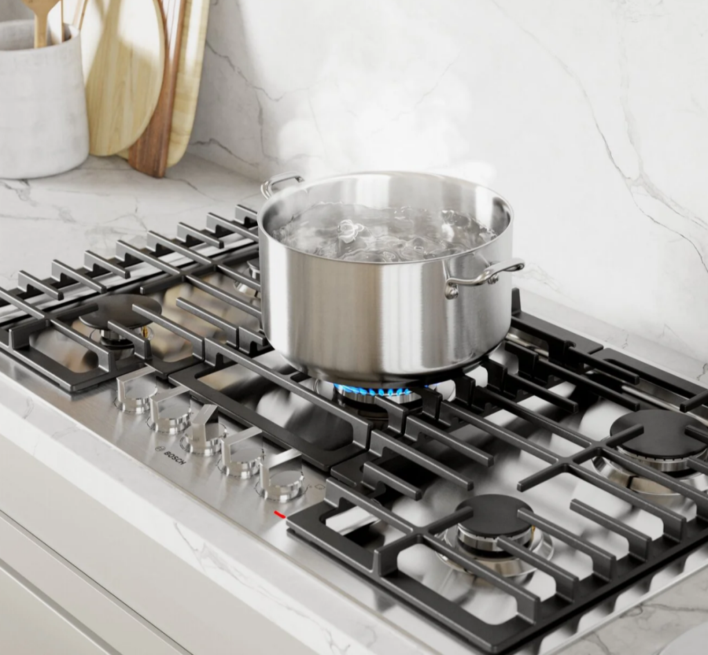 Bosch gas cooktop with a pot boiling on the burner