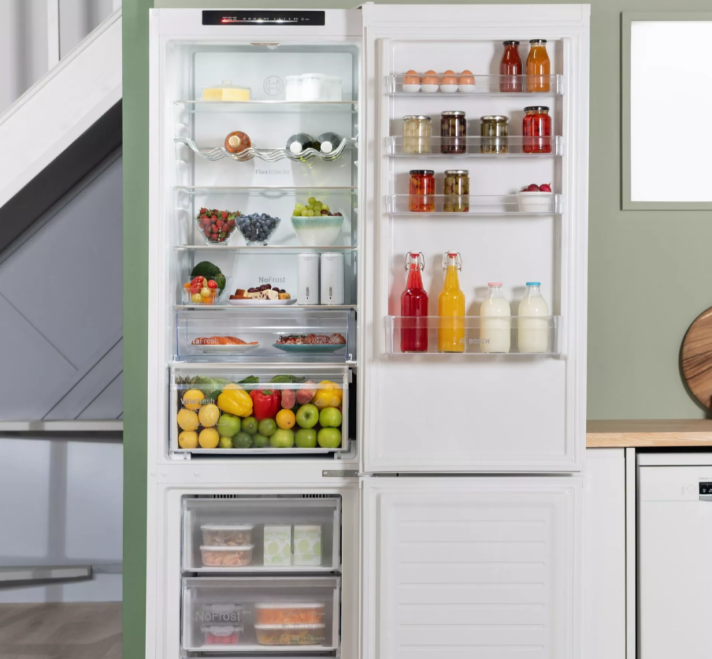 Bosch white refrigerator with open freezer drawers