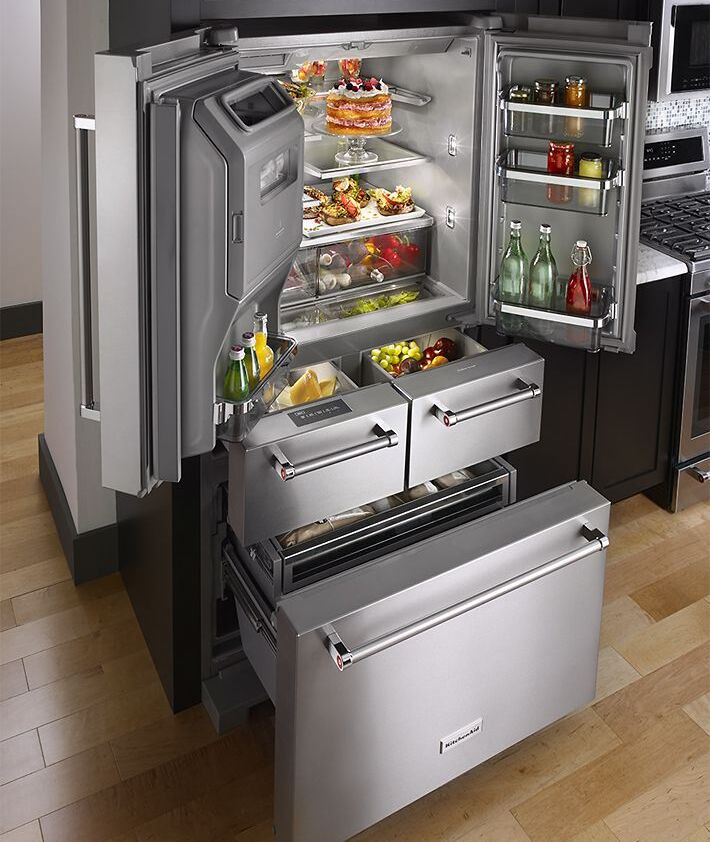 KitchenAid stainless steel French door refrigerator with open freezer drawers