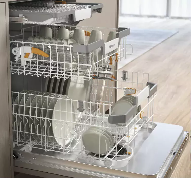 Miele built-in dishwasher with loaded racks