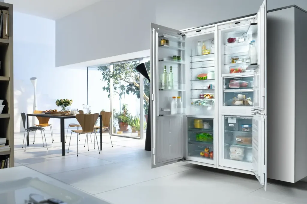 Miele built-in refrigerator and freezer columns in a modern kitchen